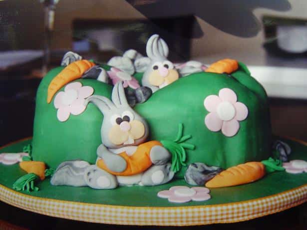 Easter cake with bunnies and carrots modeled in fondant